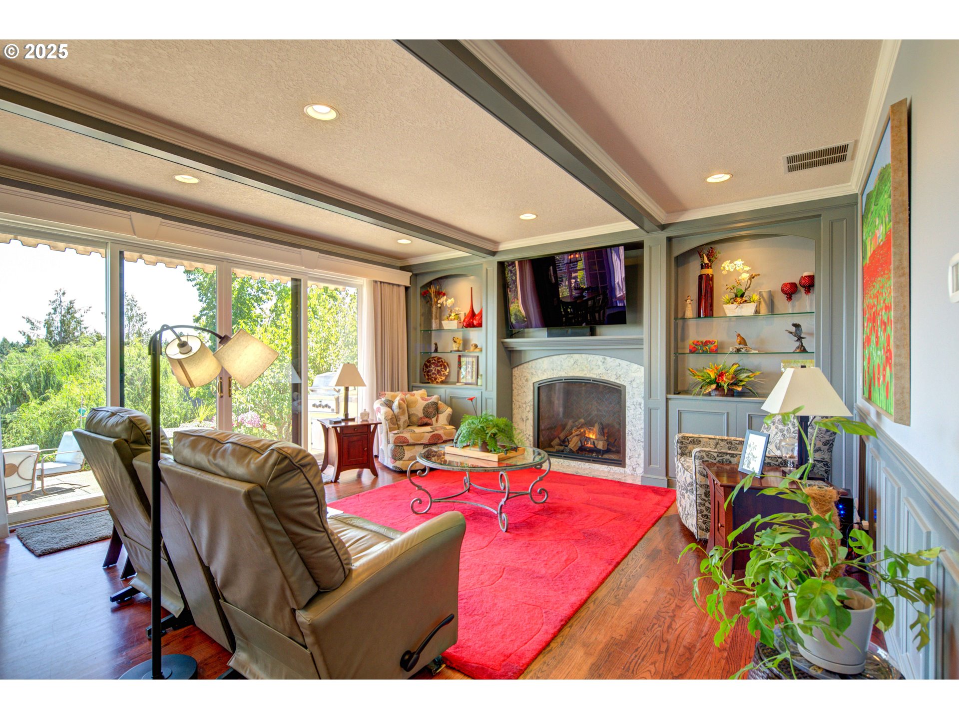33620 Southwest Firdale Road Cornelius, OR 97123 - Photo 13 of 40 a living room with furniture a fireplace and a flat screen tv