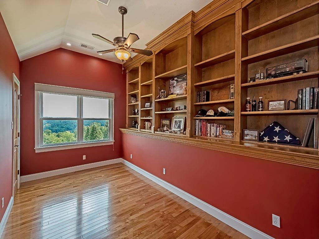 245 Reibold Road Renfrew, PA 16053 - Photo 11 of 25 a room with furniture and book shelf