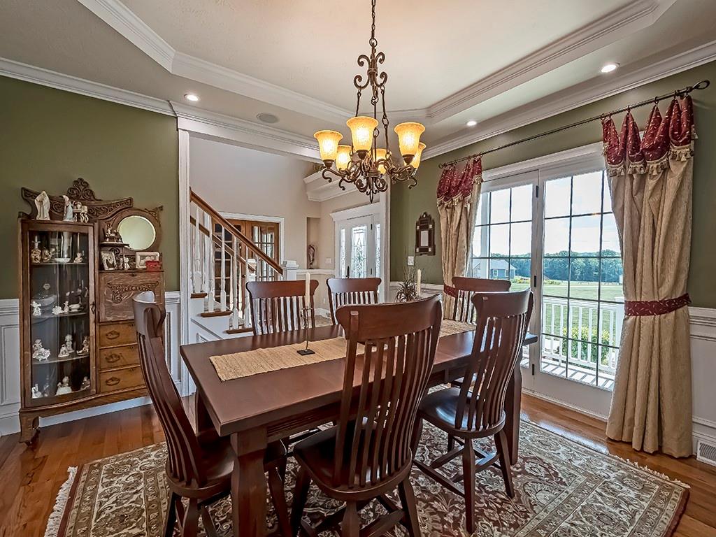 245 Reibold Road Renfrew, PA 16053 - Photo 5 of 25 a view of a dining room with furniture window and wooden floor