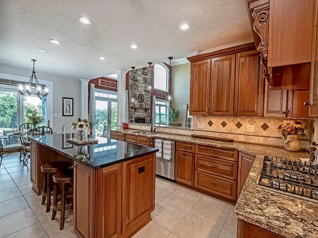 245 Reibold Road Renfrew, PA 16053 - Photo 10 of 25 a kitchen with granite countertop a sink stove and cabinets