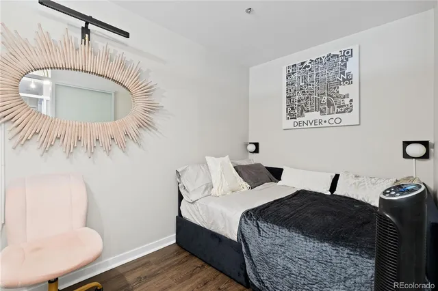 a bedroom with a bed and a mirror