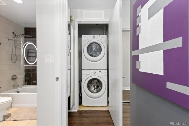 a utility room with sink dryer and washer
