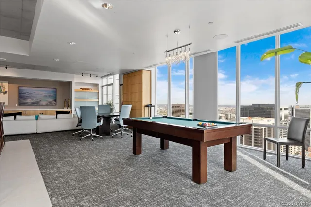 a view or dining room with furniture and window
