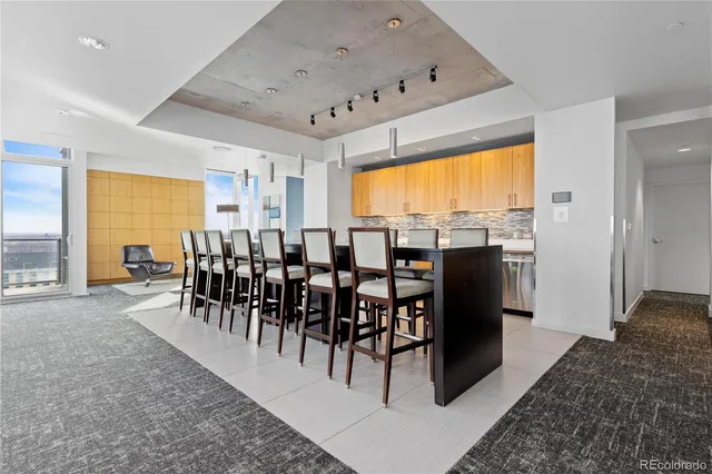 a kitchen with stainless steel appliances granite countertop a sink and cabinets
