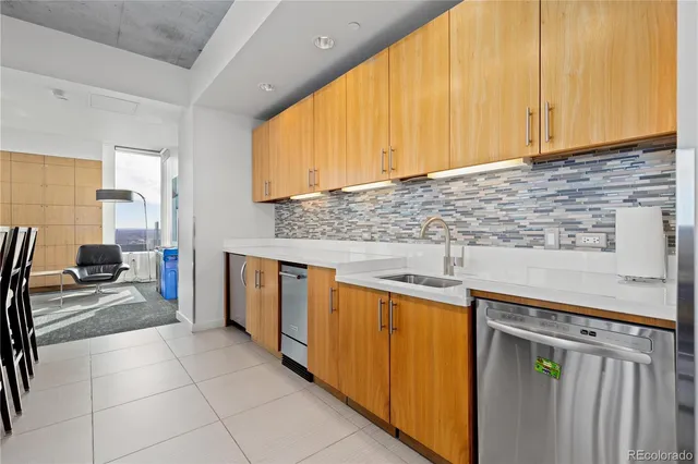 a view of a livingroom with furniture and a window