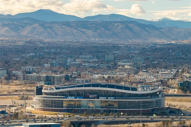 a view of parking garage with cars