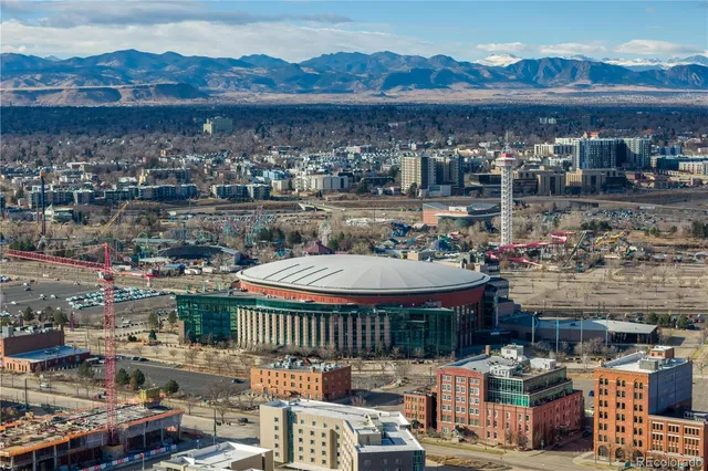 a swimming pool with outdoor seating