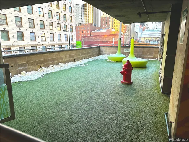 a picture of a bench in front of a wall