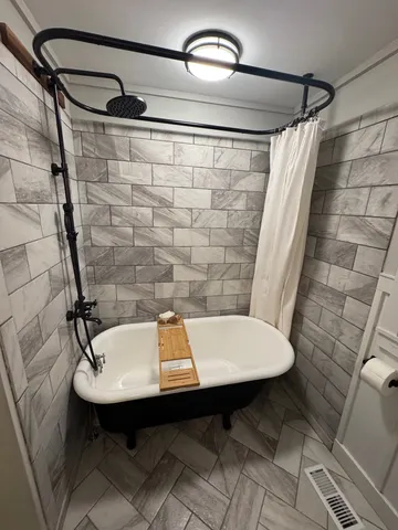 a bathroom with a sink and shower