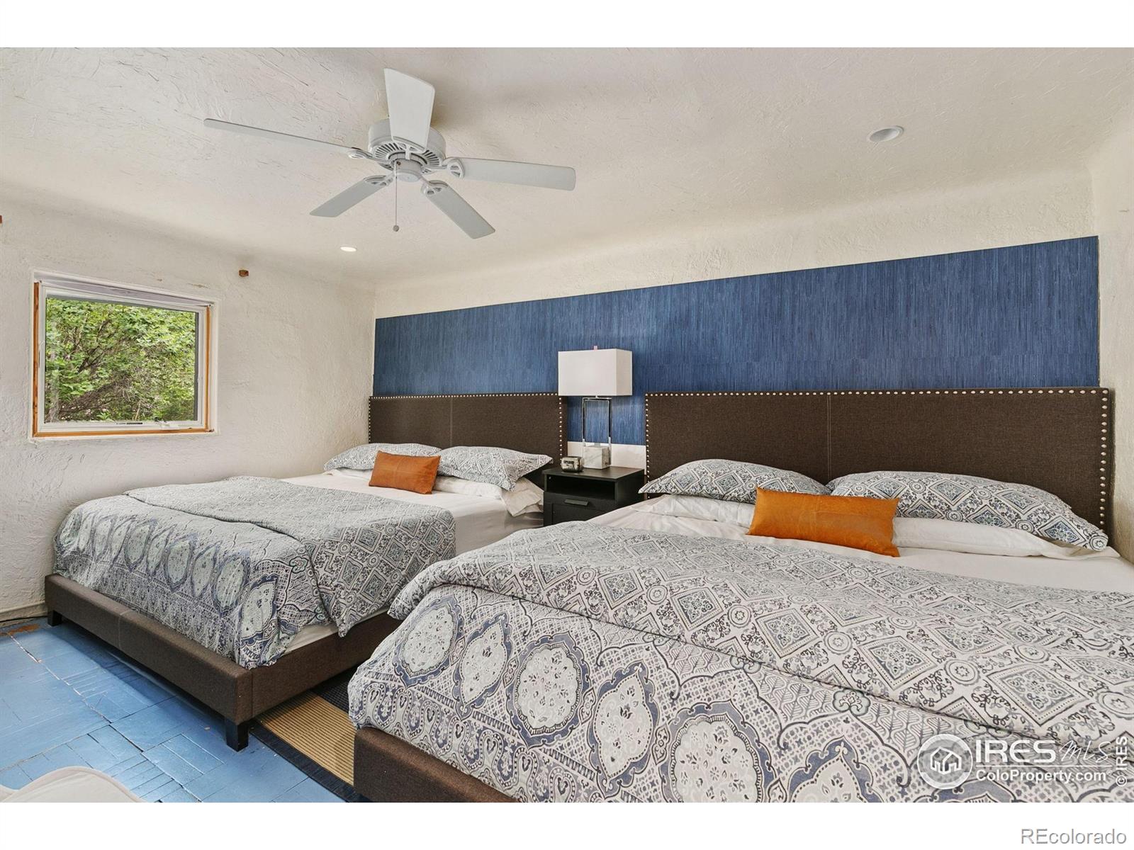 1304 West Prospect Road Fort Collins, CO 80526 - Photo 13 of 29 a bedroom with two beds and a painting