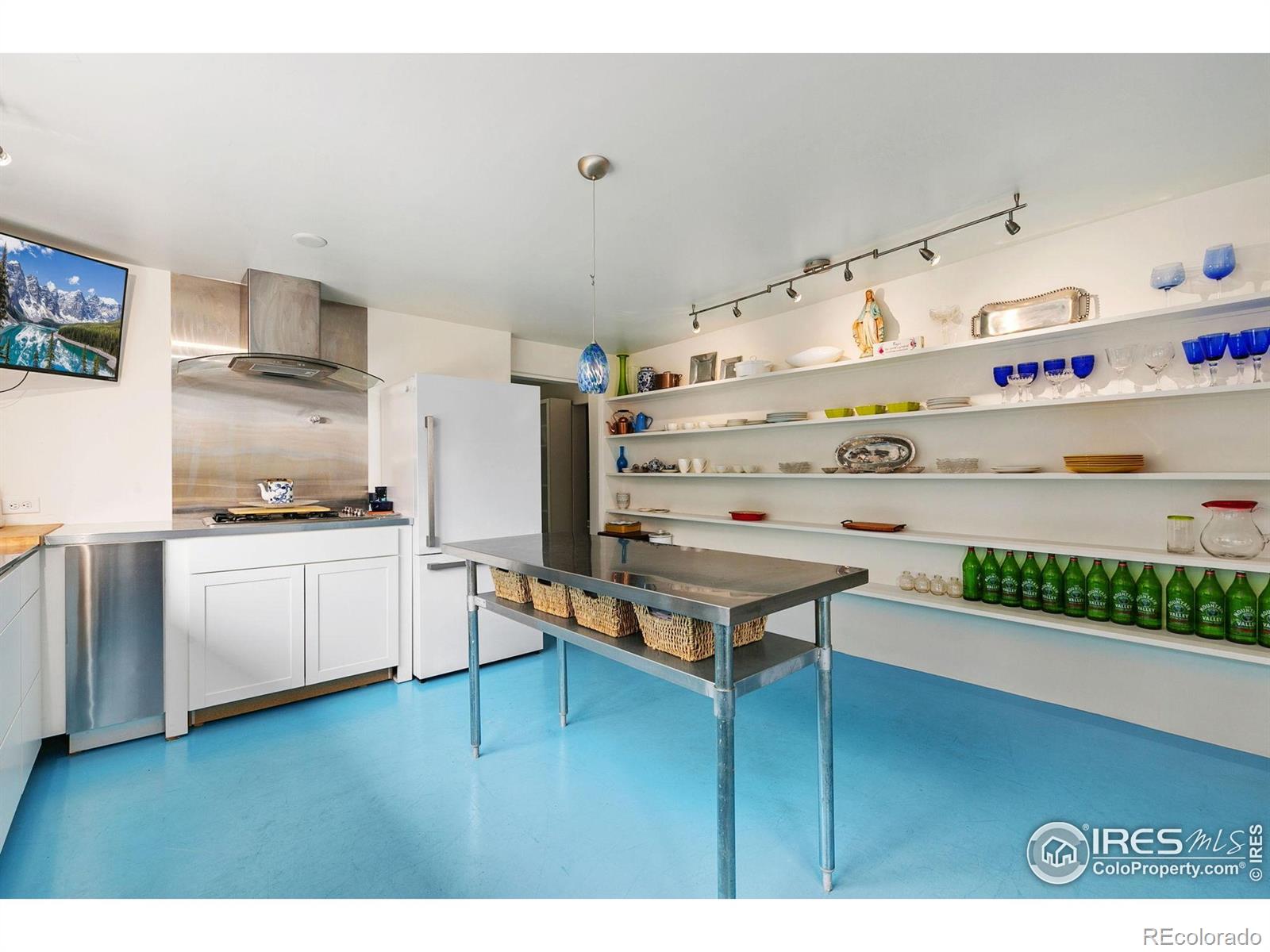 1304 West Prospect Road Fort Collins, CO 80526 - Photo 17 of 29 a kitchen with stainless steel appliances granite countertop a stove and cabinets