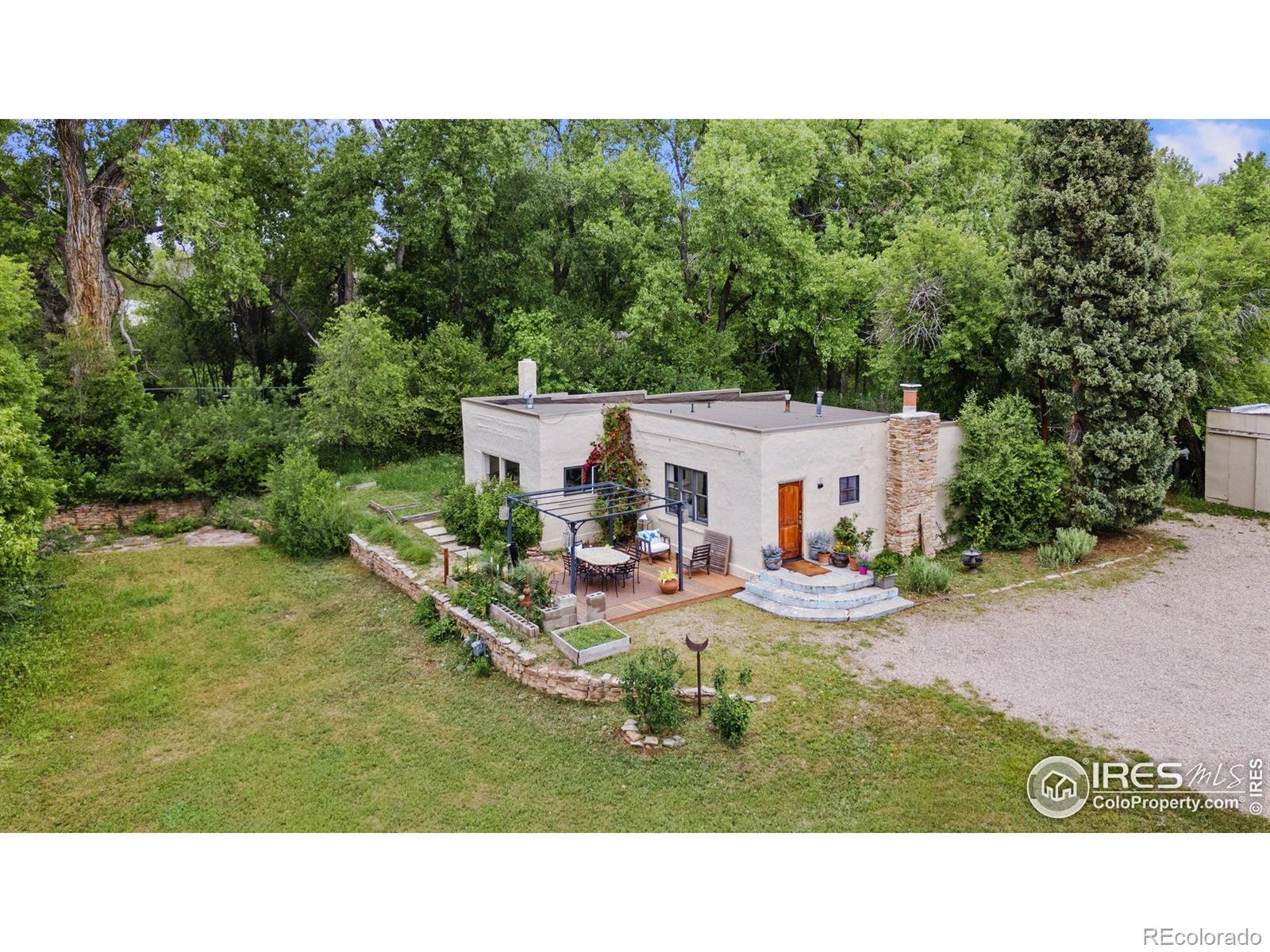 1304 West Prospect Road Fort Collins, CO 80526 - Photo 22 of 29 a view of a house with backyard and sitting area