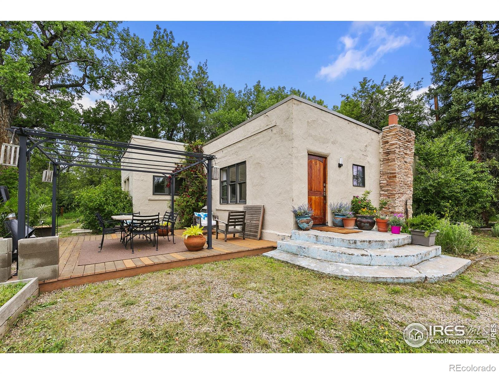 1304 West Prospect Road Fort Collins, CO 80526 - Photo 3 of 29 a view of a house with backyard porch and outdoor seating