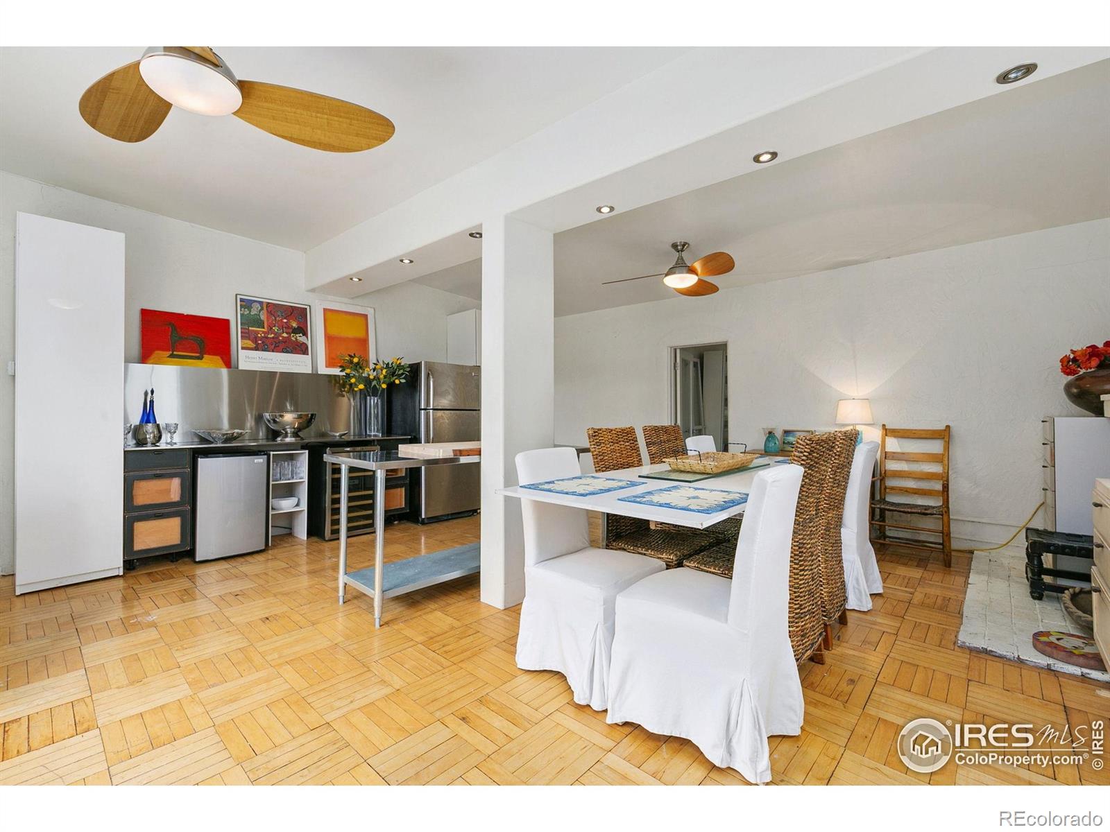 1304 West Prospect Road Fort Collins, CO 80526 - Photo 9 of 29 a living room with kitchen furniture and a wooden floor