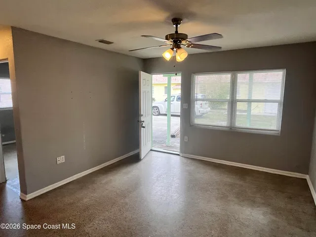 a view of an empty room with a window