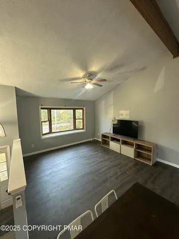 a view of livingroom with hardwood floor and a window