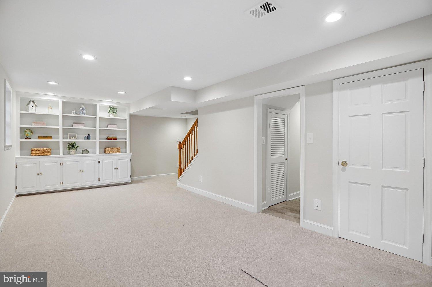 4622 Woodfield Road Bethesda, MD 20814 - Photo 37 of 75 Rec Room w/ Built-Ins & Walk Out Exit to Rear Yard