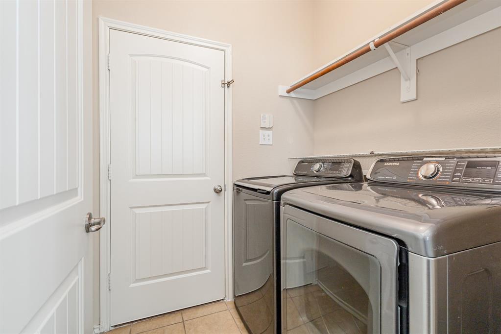 9732 Hedge Bell Drive McKinney, TX 75072 - Photo 14 of 24 a utility room with dryer and washer