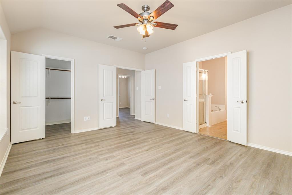 9732 Hedge Bell Drive McKinney, TX 75072 - Photo 16 of 24 a view of empty room with wooden floor