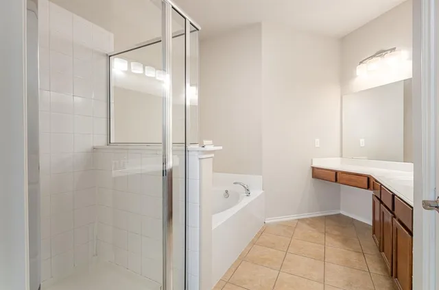 a bathroom with a bathtub and a sink