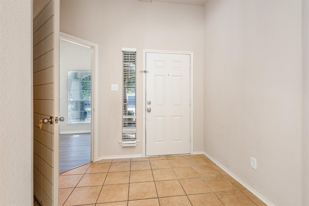 9732 Hedge Bell Drive McKinney, TX 75072 - Photo 4 of 24 an empty room with windows