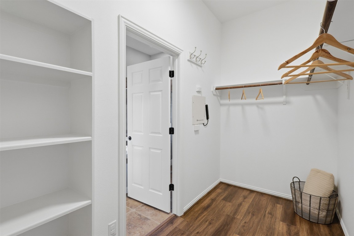 66 Whetstone Ridge Way Spring, TX 77382 - Photo 11 of 39 The primary walk-in closet provides railing and shelving to keep your wardrobe organized.