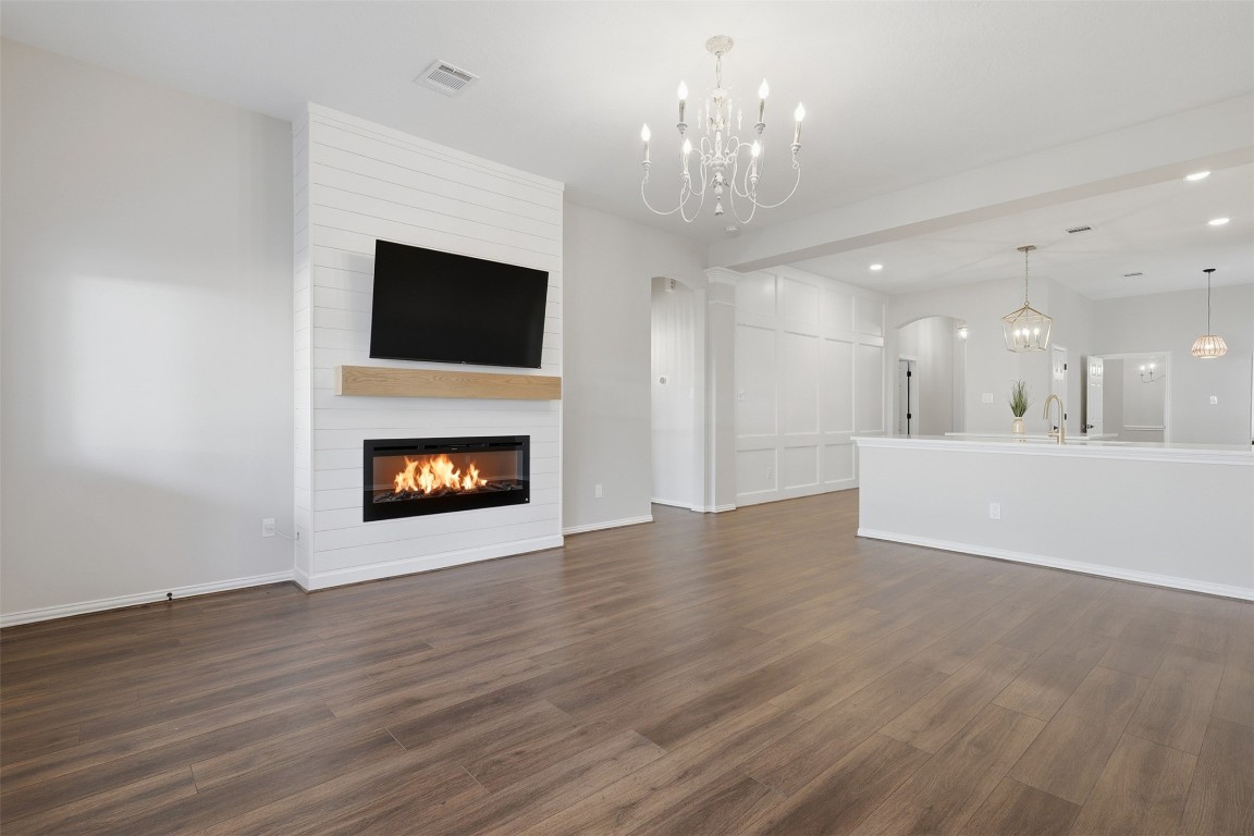 66 Whetstone Ridge Way Spring, TX 77382 - Photo 13 of 39 The living room is open to the kitchen which makes it ideal for entertaining friends and family.