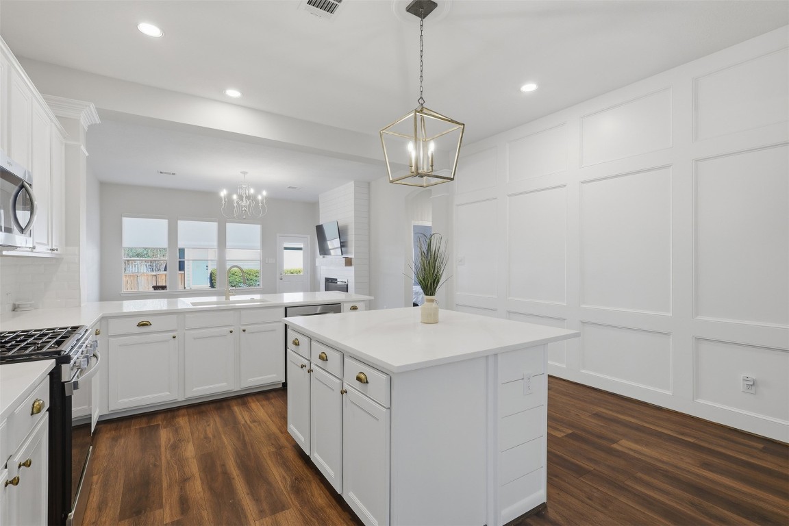 66 Whetstone Ridge Way Spring, TX 77382 - Photo 16 of 39 Another view of the kitchen showcasing the island, overhead recessed lighting, and the openness to the living room area.