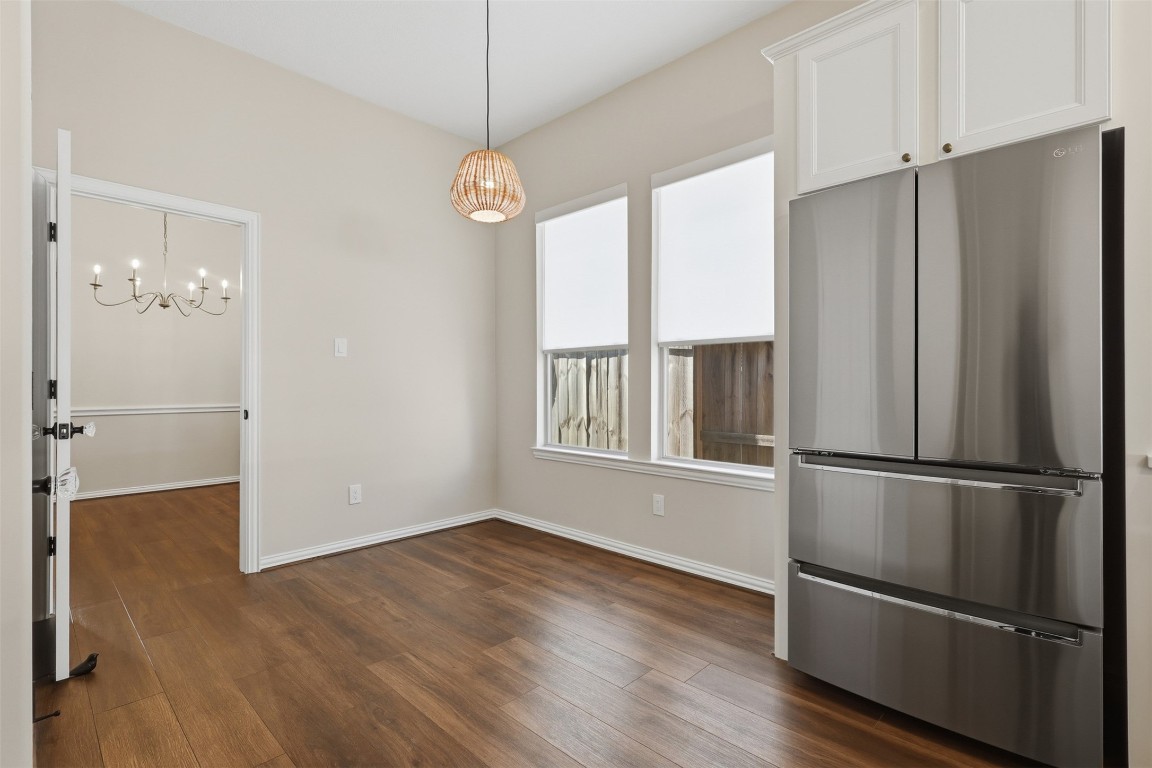 66 Whetstone Ridge Way Spring, TX 77382 - Photo 17 of 39 The breakfast nook is conveniently located in the kitchen and it's helpful that the pantry is across from the space. The sellers updated the window coverings to easy pull down shades.