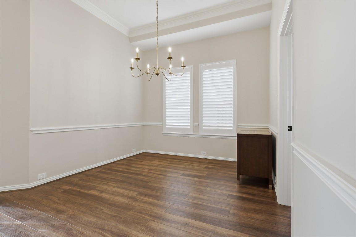 66 Whetstone Ridge Way Spring, TX 77382 - Photo 18 of 39 The formal dining room features a custom overhead light fixture, plantation shutters, and neutral Sherwin Williams paint.