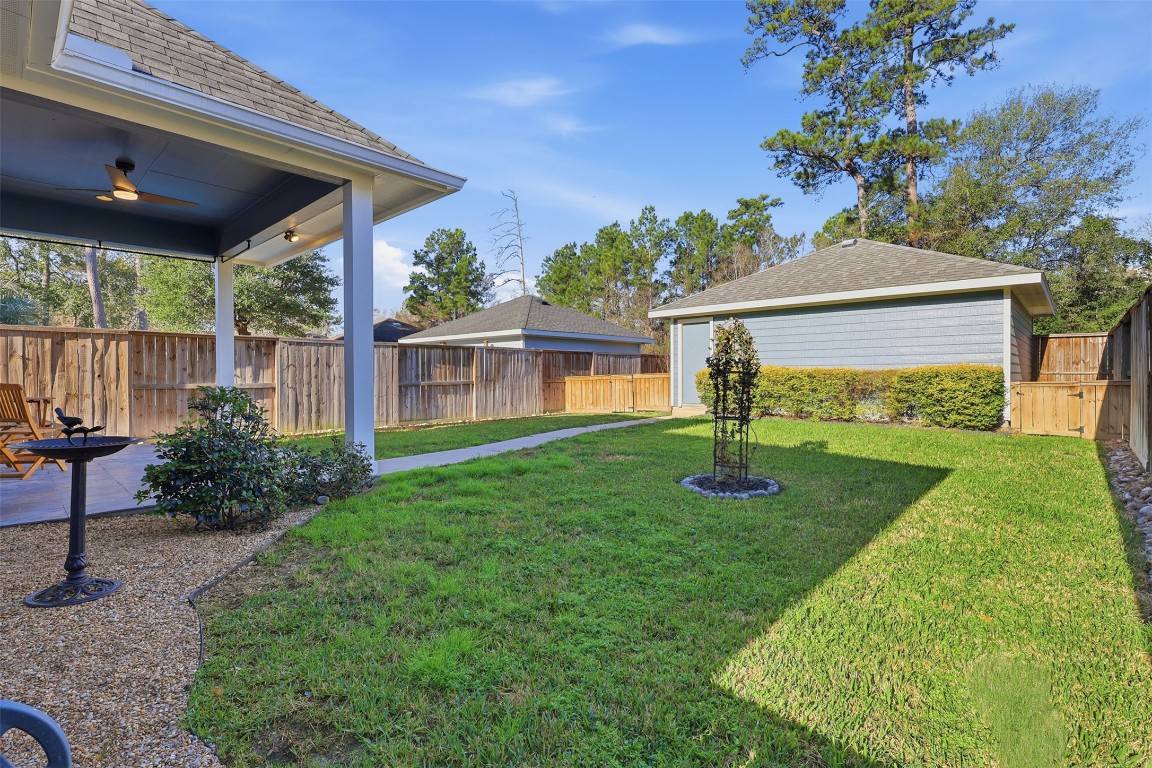 66 Whetstone Ridge Way Spring, TX 77382 - Photo 27 of 39 Enjoy year-round outdoor living in this private backyard.