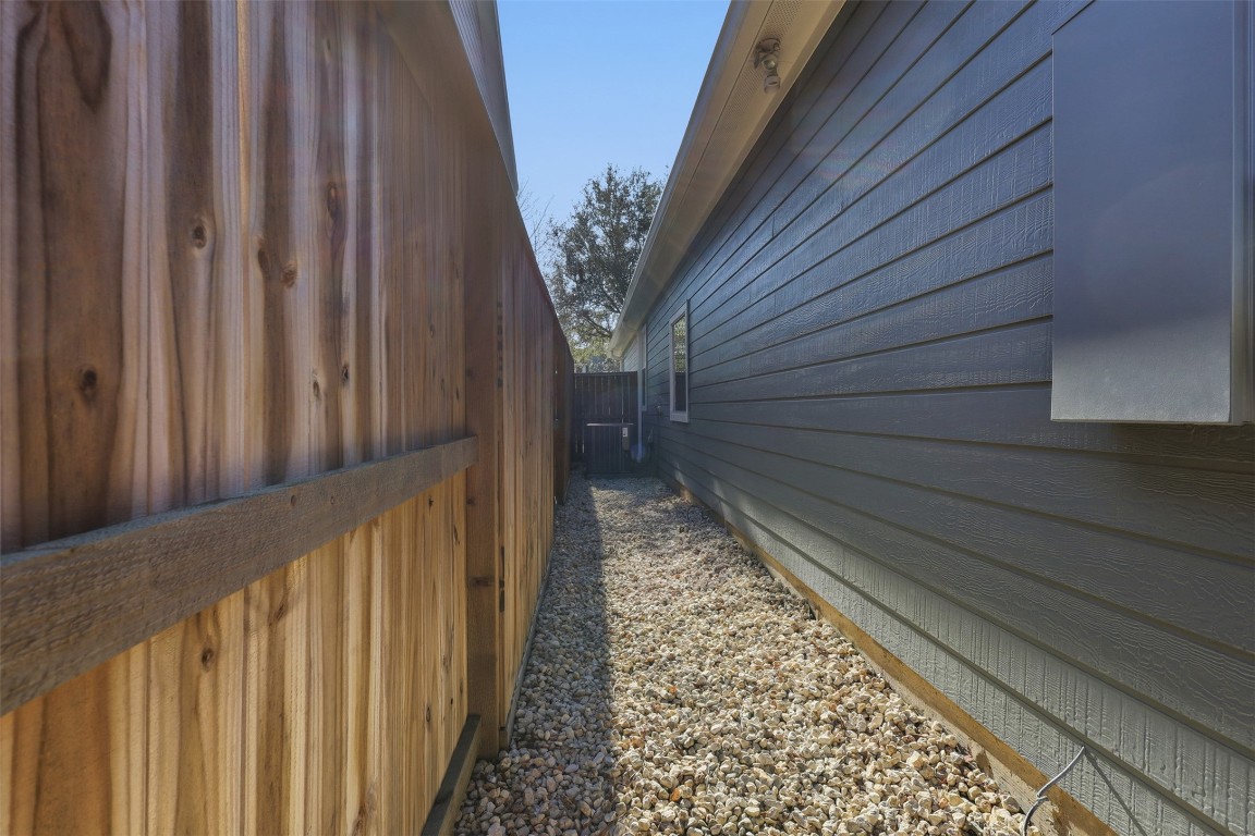 66 Whetstone Ridge Way Spring, TX 77382 - Photo 28 of 39 Rock hardscaping located between the home and fence.