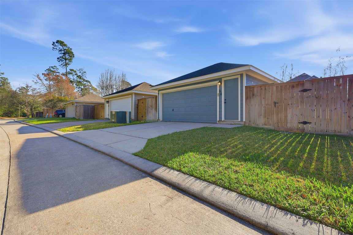 66 Whetstone Ridge Way Spring, TX 77382 - Photo 30 of 39 This home does not have back neighbors. You'll see from this view the detached garage is in the rear of the property, and it faces the alleyway. This home has a driveway for off-street parking.