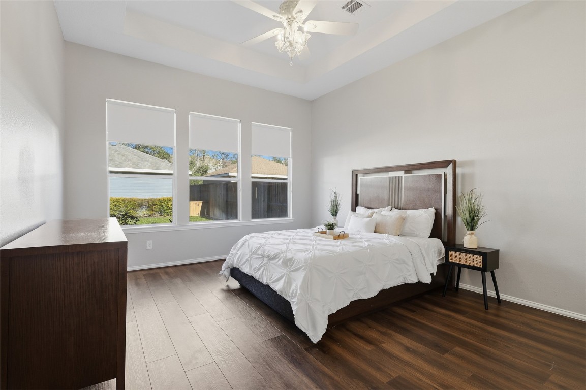 66 Whetstone Ridge Way Spring, TX 77382 - Photo 7 of 39 The primary suite is private with a neutral color palette and updated luxury wide plank flooring.