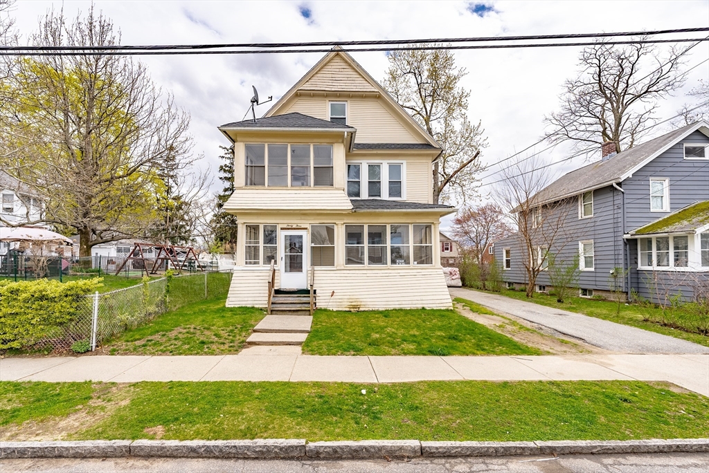 33 Littleton Street Springfield, MA 01104 - Photo 1 of 19 a view of a house with a yard and plants