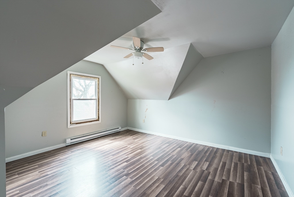 33 Littleton Street Springfield, MA 01104 - Photo 14 of 19 an empty room with wooden floor and windows