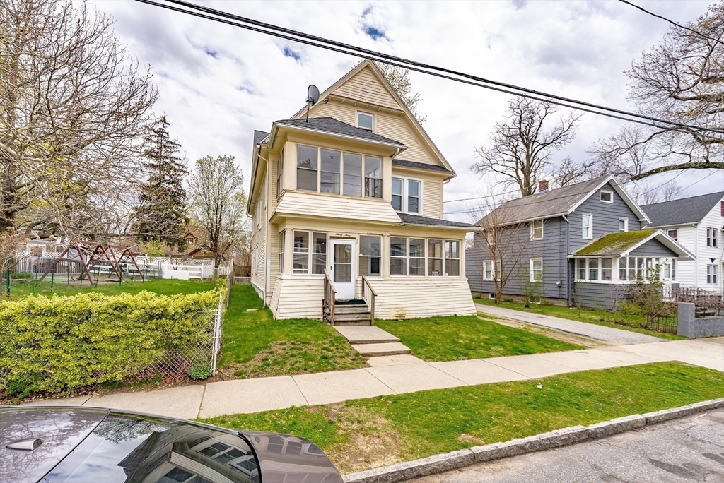 33 Littleton Street Springfield, MA 01104 - Photo 2 of 19 a front view of a house with a yard