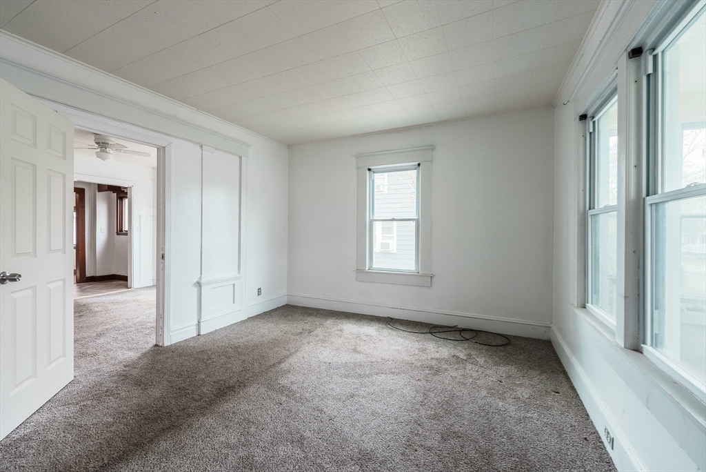 33 Littleton Street Springfield, MA 01104 - Photo 6 of 19 an empty room with windows