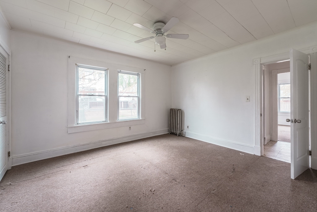 33 Littleton Street Springfield, MA 01104 - Photo 7 of 19 a view of an empty room with a window