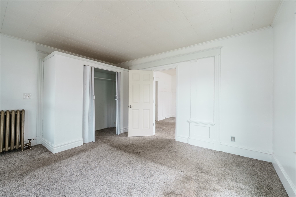33 Littleton Street Springfield, MA 01104 - Photo 8 of 19 a view of an empty room and closet area