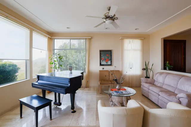 a bed room with furniture and a chandelier