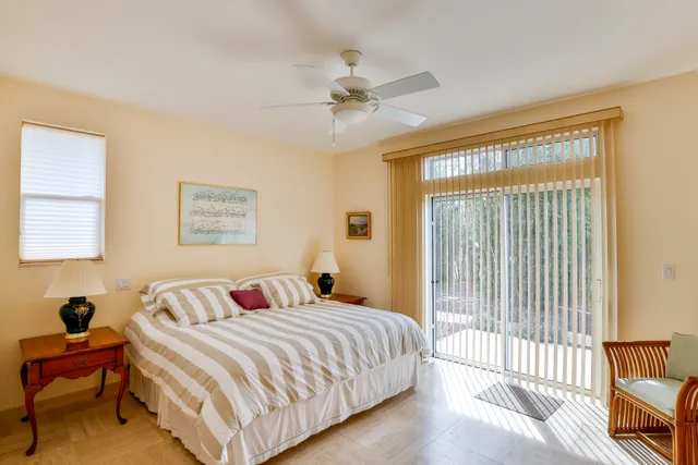 a kitchen with kitchen island granite countertop a sink and cabinets