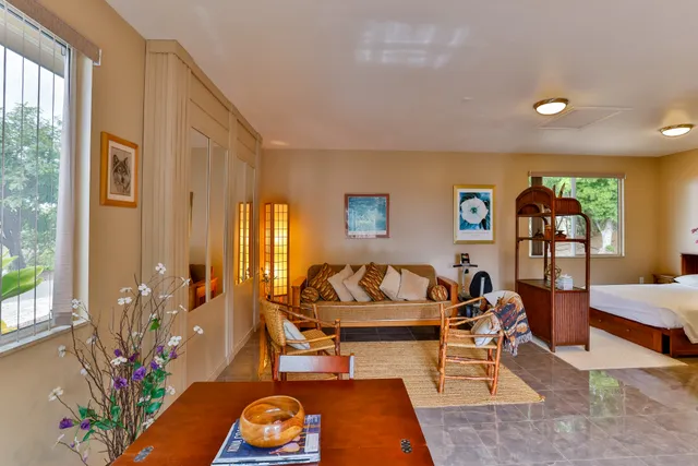 a kitchen with stainless steel appliances granite countertop a refrigerator a sink a stove and island