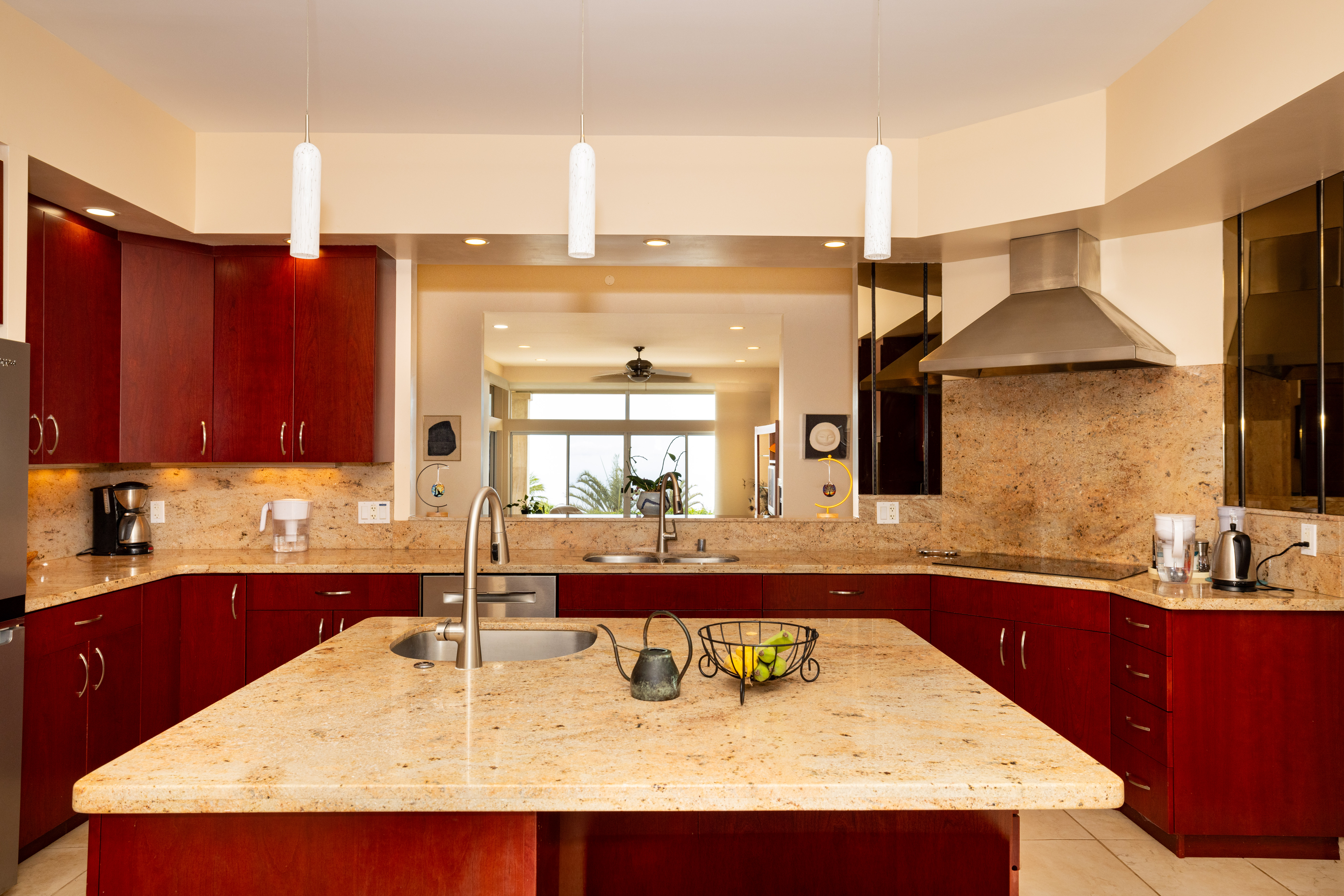 59-1638 Kohala Ranch Road Kamuela, HI 96743 - Photo 25 of 29 a kitchen with kitchen island granite countertop a sink and cabinets