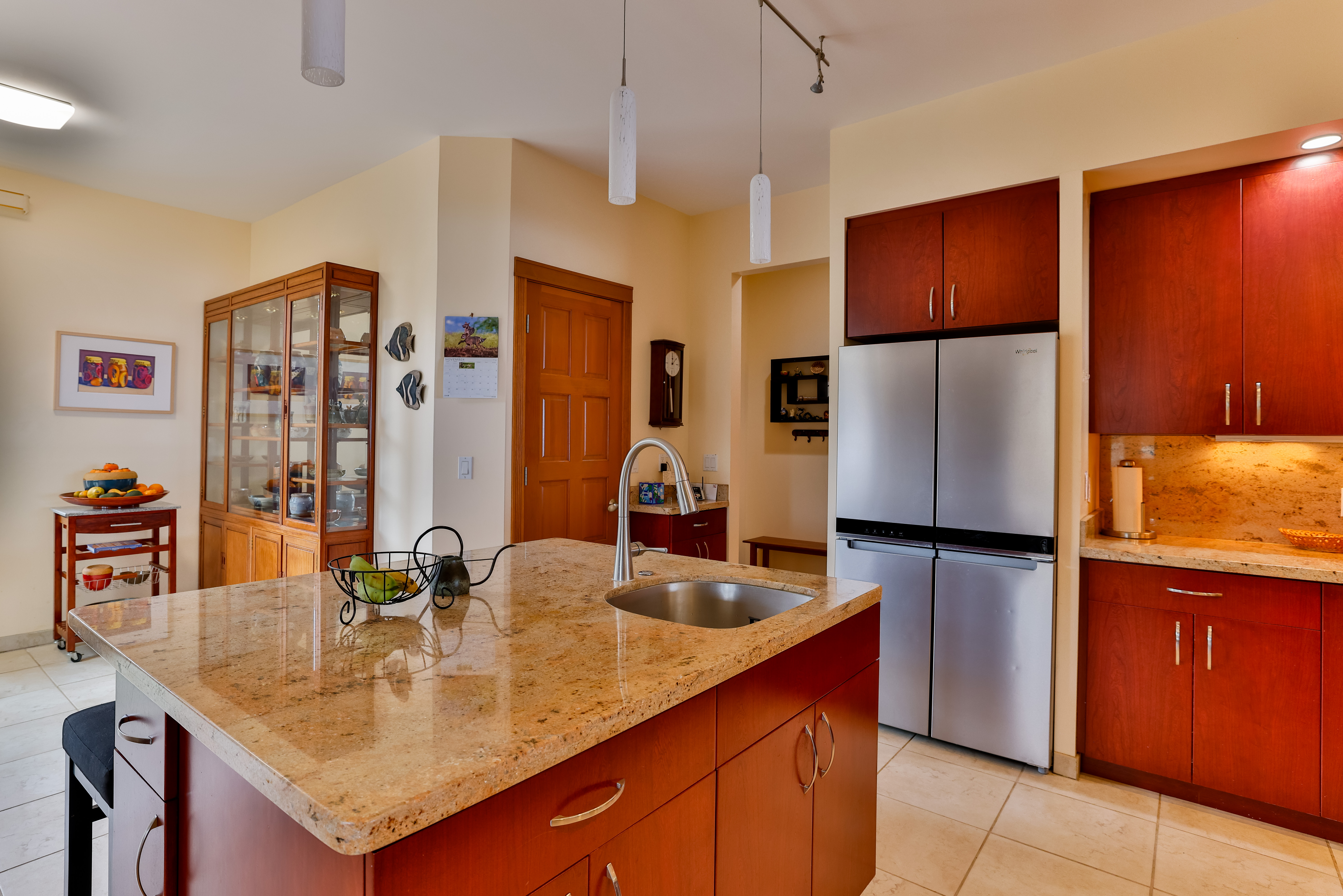 59-1638 Kohala Ranch Road Kamuela, HI 96743 - Photo 26 of 29 a kitchen with stainless steel appliances granite countertop a refrigerator a sink a stove and island