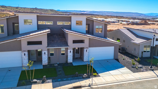 2972 West 570 North Hurricane, UT 84737 - Photo 3 of 104 Contemporary house with a mountain view, driveway, and stucco siding