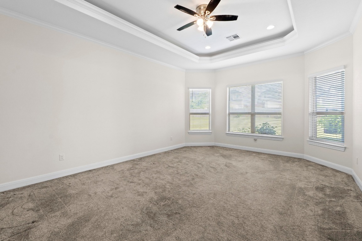 200 Tate Lane Round Rock, TX 78665 - Photo 14 of 40 an empty room with windows and ceiling fan