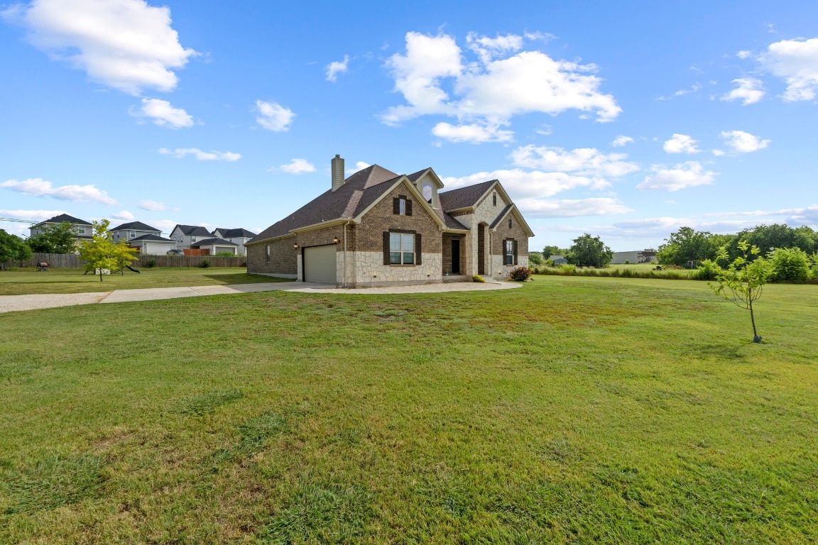 200 Tate Lane Round Rock, TX 78665 - Photo 2 of 40 a view of a house with a big yard
