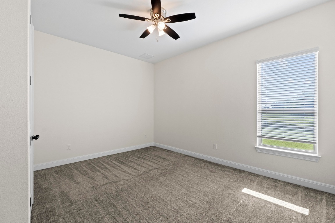 200 Tate Lane Round Rock, TX 78665 - Photo 25 of 40 an empty room with windows