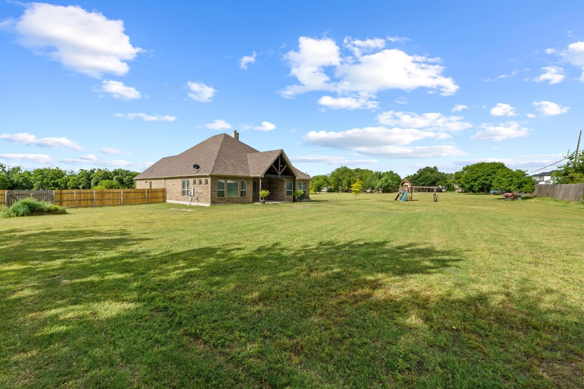 200 Tate Lane Round Rock, TX 78665 - Photo 30 of 40 a front view of a house with garden